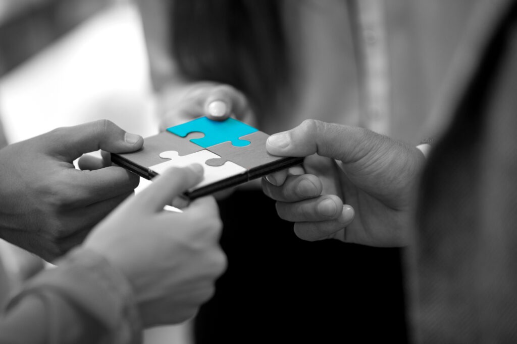 business people jigsaw puzzle collaboration team concept